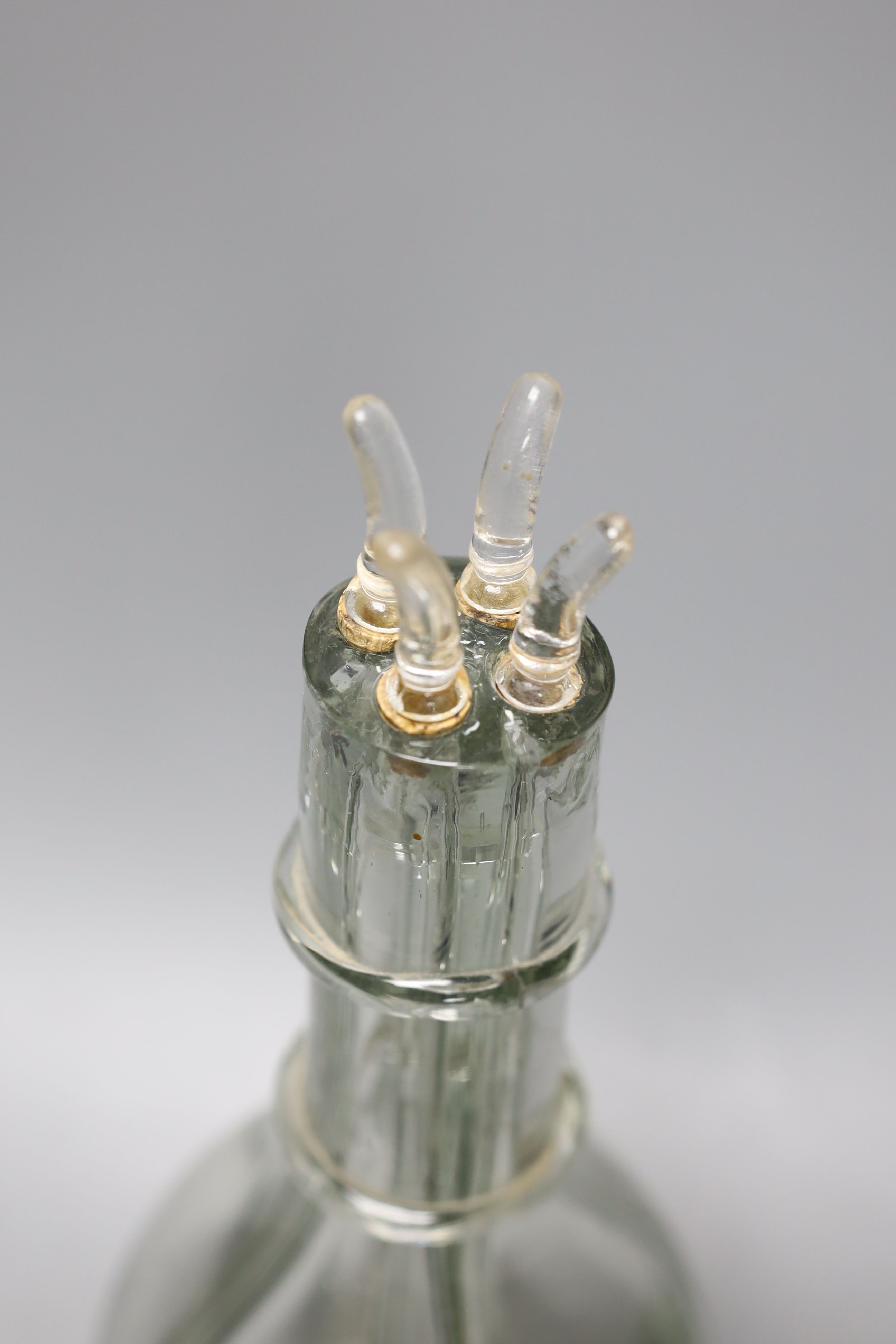 A French four division moulded glass oil and vinegar bottle, 32cm